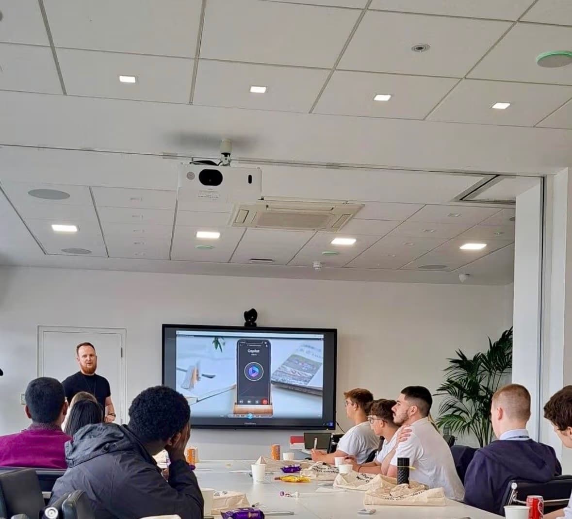 Shea Campbell presenting on AI to a group